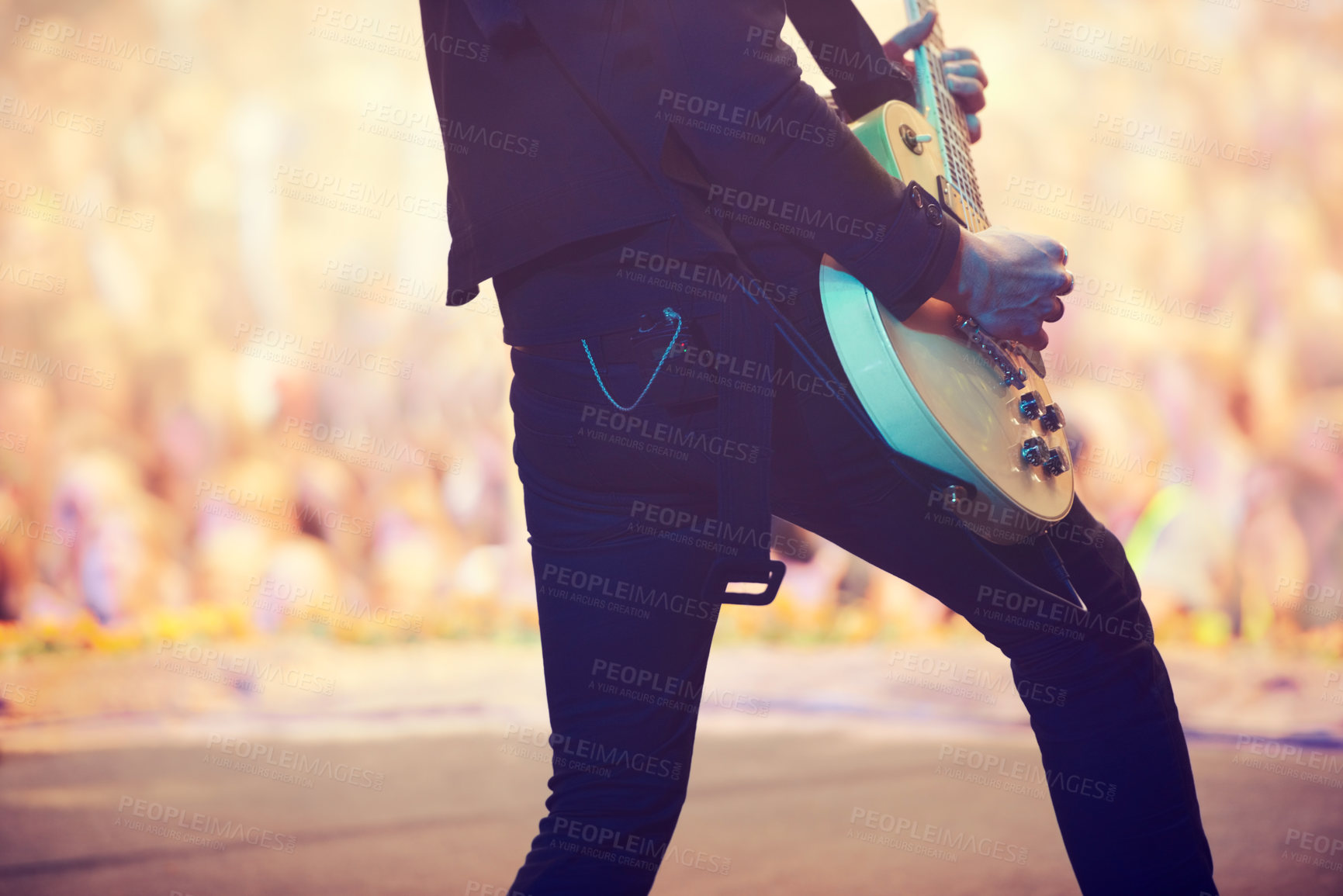 Buy stock photo Cropped shot of a guitarist performing on stage