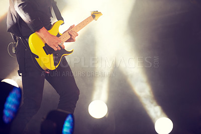 Buy stock photo Guitar, stage and man at music festival, concert or live event in Amsterdam. Musician, artist and electric instrument with lights and playing for audience, crowd or spectators at night for enjoyment