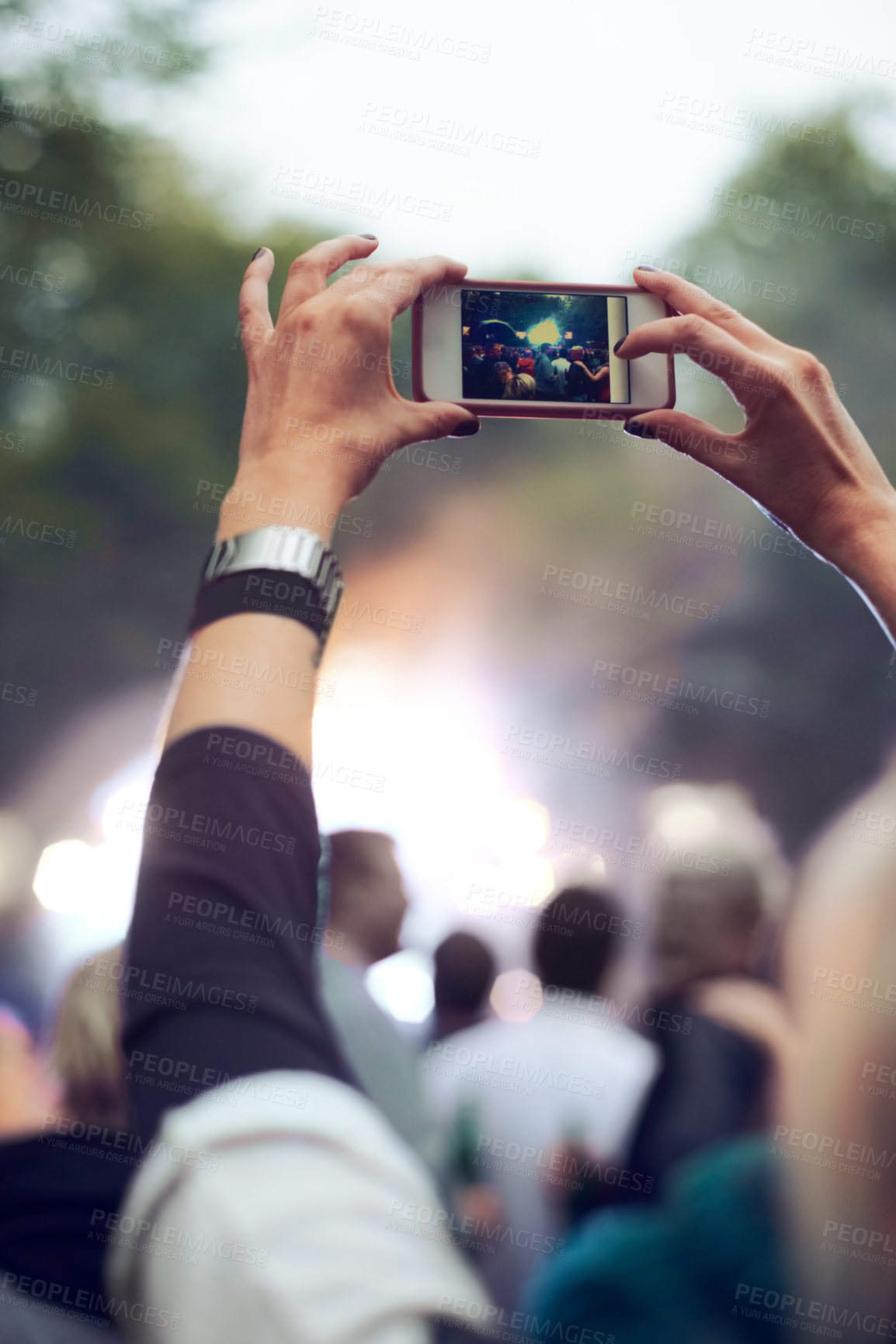 Buy stock photo Hands, cellphone and picture at music concert in crowd for social media post for holiday, carnival or celebration. Person, photography and summer event for travel party or forest, camping or festival