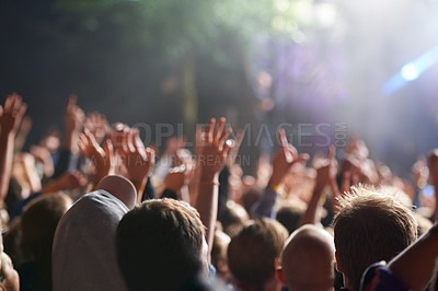 Buy stock photo Hands, people and crowd at music festival with dancing for rock party at concert with stage lights, nightclub or dj. Group, entertainment and holiday techno in summer for new years, adventure or rave