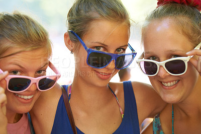 Buy stock photo Portrait, music festival and women with fashion, sunglasses and summer with happiness and bonding together. Face, smile and outdoor with friends or eyewear with weekend break and excited with culture