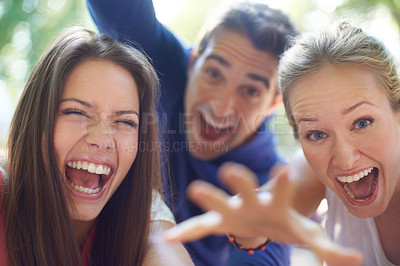 Buy stock photo Portrait, friends and laughing at festival in nature, bonding and celebration with funny joke in woods. Man, women or silly face on camp for crazy hand gesture or outdoor adventure in denmark forest