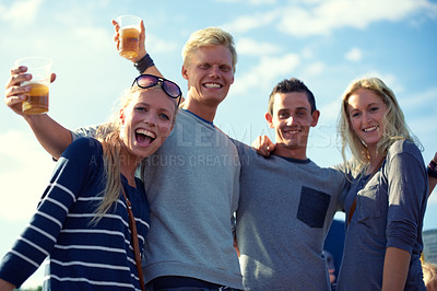 Buy stock photo Portrait, beer and group of friends party, celebration or happy adventure together on low angle. Smile, drinks and blue sky, men and women on vacation to relax with bonding, alcohol and holiday event