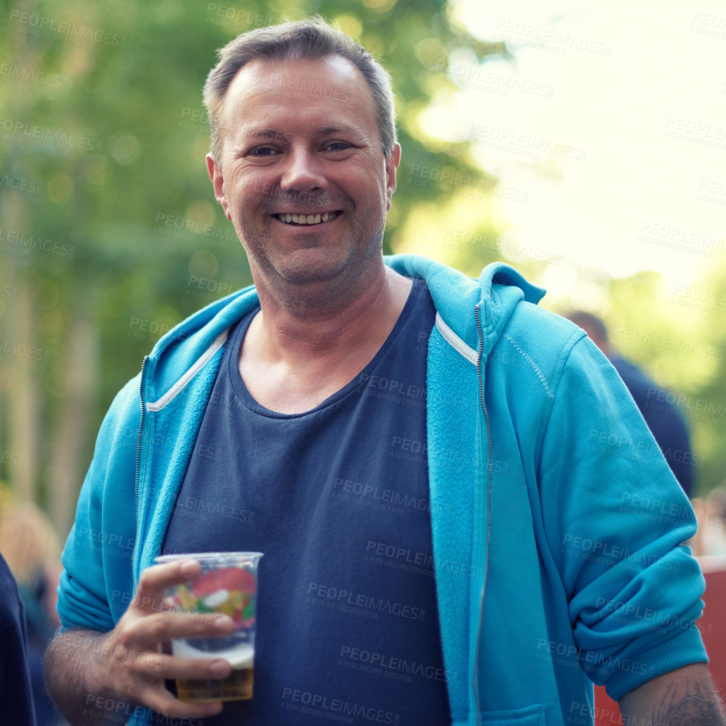 Buy stock photo Portrait, beer and man at outdoor party, celebration or happy adventure at holiday event in Germany. Smile, drinks and nature, mature person on vacation to relax with alcohol at Munich festival.