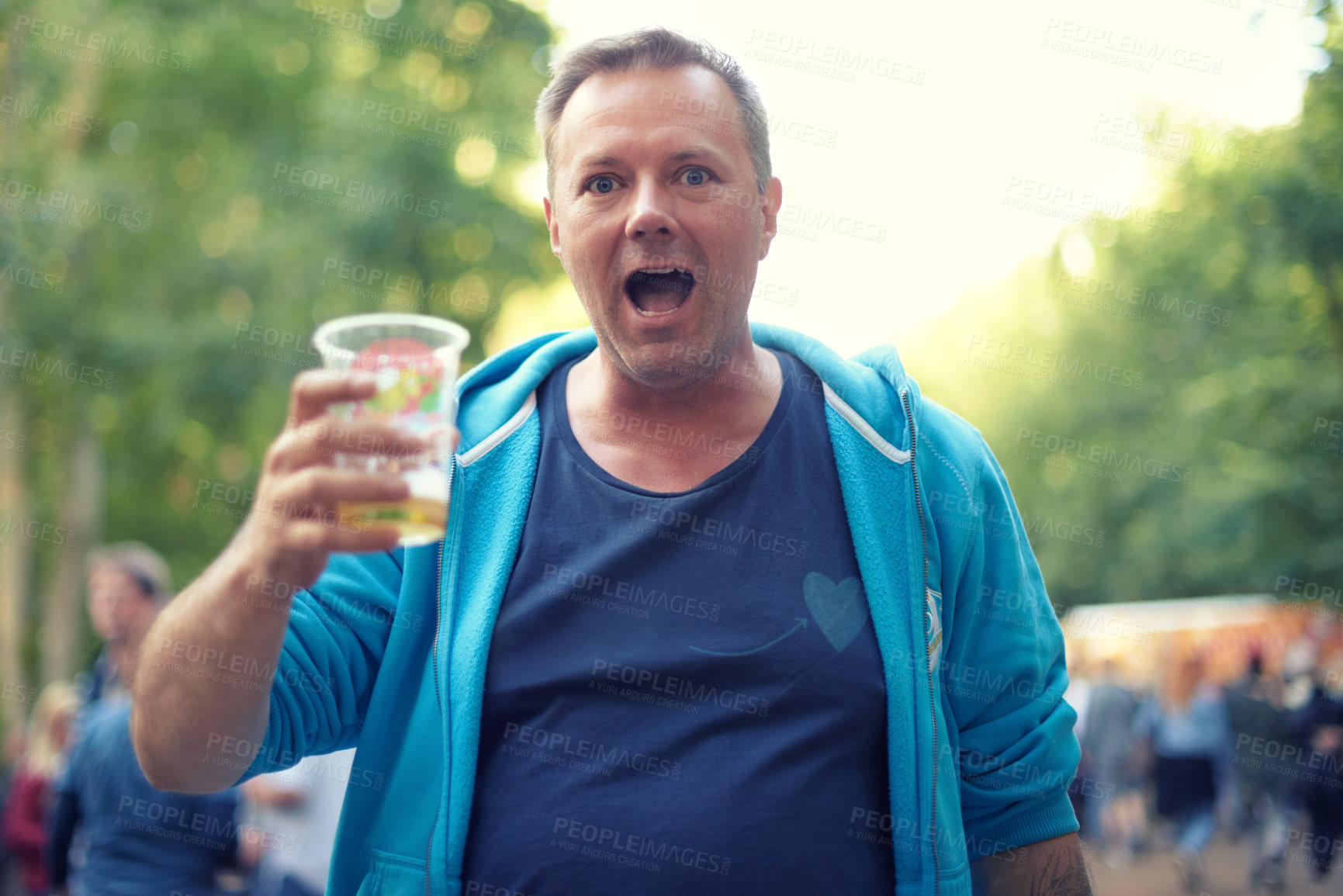 Buy stock photo Mature, man and portrait with beer outdoor at festival in park, woods or party in nature. Person, drinking and toast with plastic cup with alcohol for celebration at event in forest or summer
