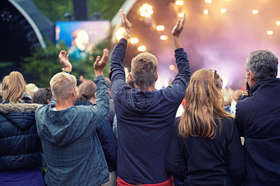 Buy stock photo A crowd dancing at an outdoor music event