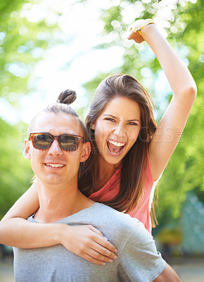 Buy stock photo Love, portrait and happy couple with piggyback in a park for freedom, celebration or bonding outdoor. Travel, energy and excited people face in forest for fun vacation, holiday or back ride adventure