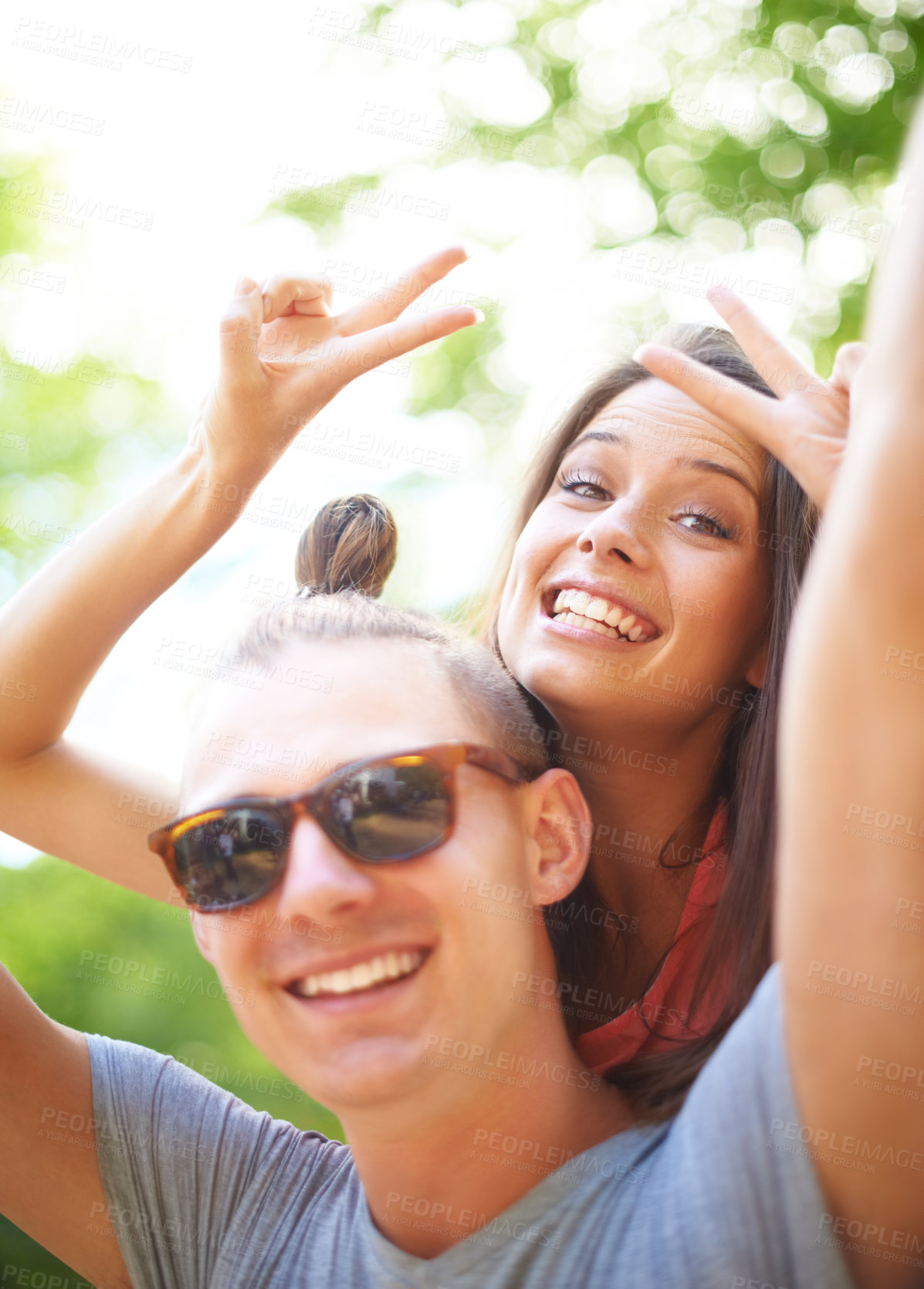 Buy stock photo Portrait, piggyback and smile of couple with peace sign at music festival, event and celebration on valentines day together in summer. Face, man and happy woman with v hand gesture at party outdoor