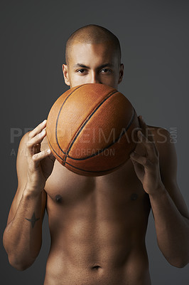 Buy stock photo Portrait, fitness and basketball with shirtless athlete in studio isolated on gray background for training. Exercise, health or wellness and body of serious young man with game ball for competition