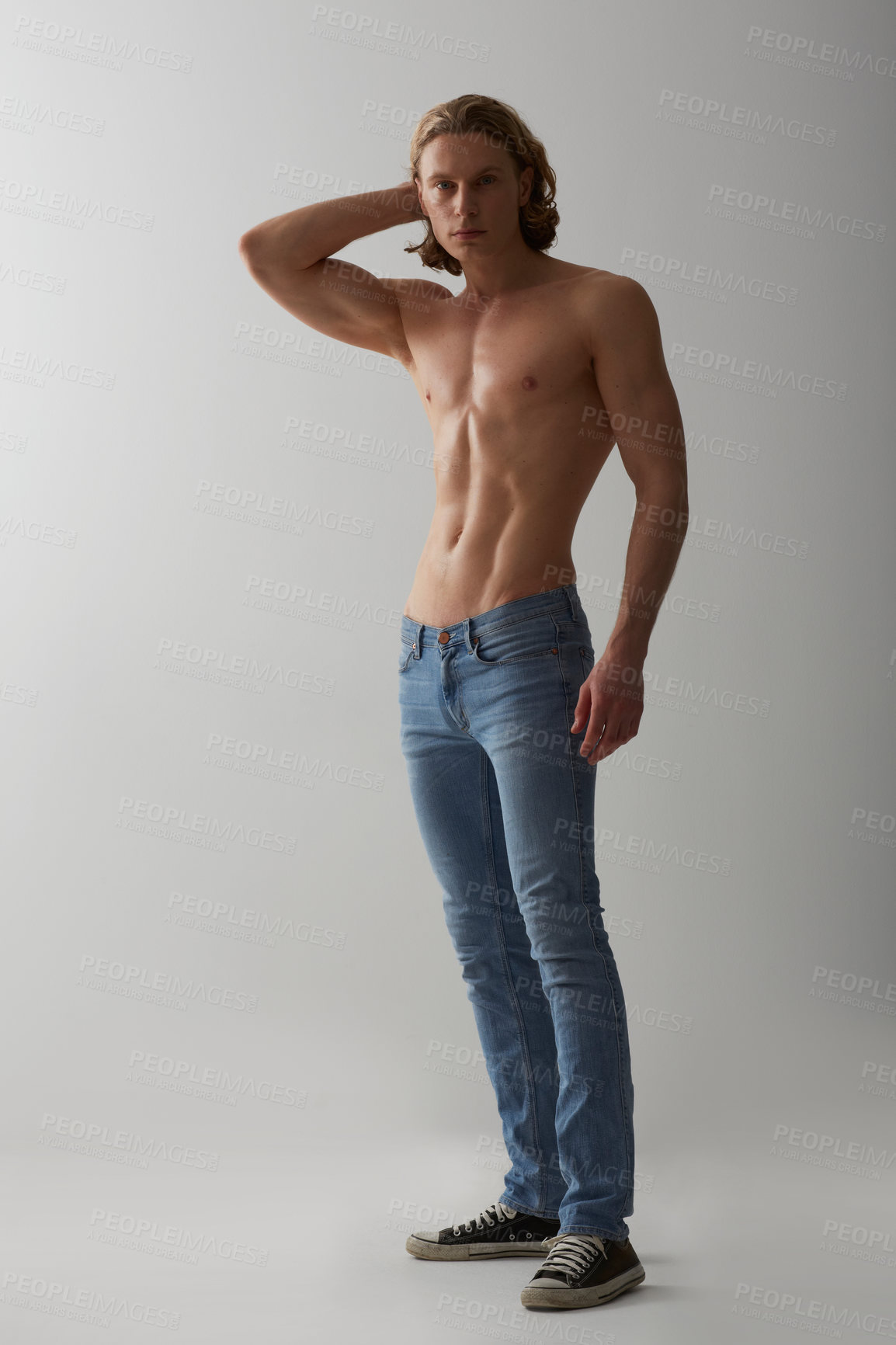 Buy stock photo Studio shot of a young man with a bare chest