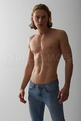 Buy stock photo Shirtless, model and portrait of man in jeans on studio, white background and mockup with fashion. Male, beauty and topless person with abs in denim pants, cool style and confidence in backdrop