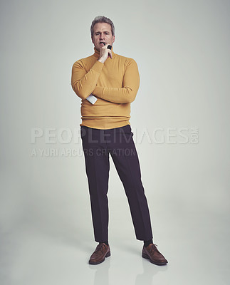 Buy stock photo Studio shot of a mature man with a serious facial expression