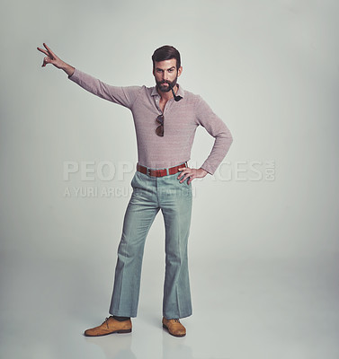 Buy stock photo 70s, fashion and portrait of man with retro or vintage aesthetic in gray background of studio. Smoking, pipe and person dance with peace and confidence in funky sunglasses and unique style from past
