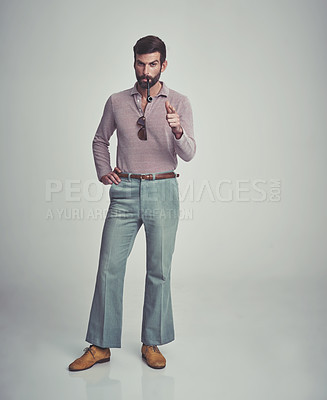 Buy stock photo Vintage, fashion and portrait of man with 70s retro aesthetic in gray background of studio. Smoking, pipe and serious person with confidence and pride in funky clothes and unique style from past