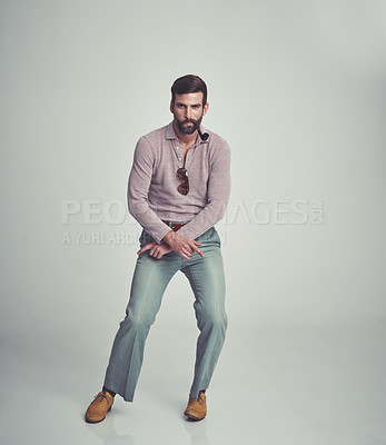 Buy stock photo Vintage, fashion and portrait of man with 70s retro aesthetic in gray background of studio. Smoking, pipe and person dance with confidence in funky sunglasses, clothes and unique style from past