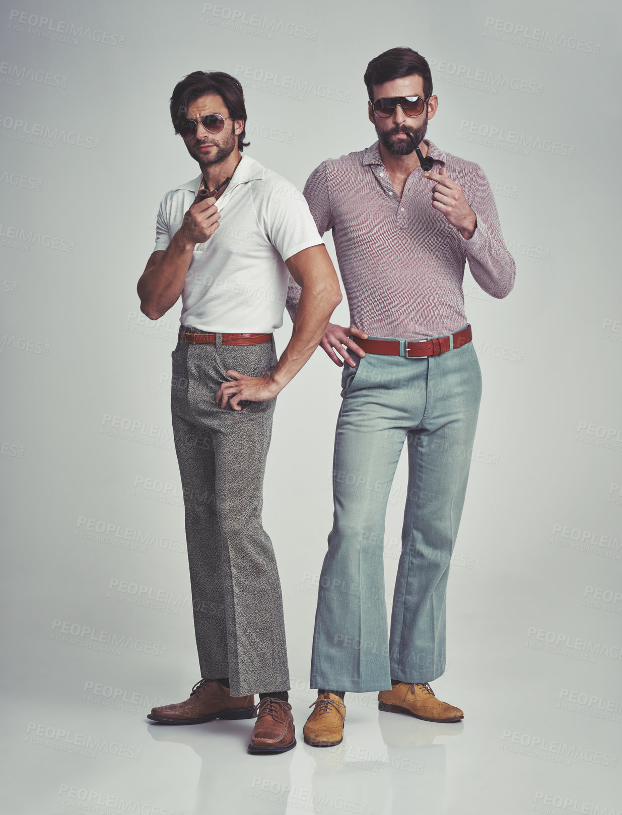 Buy stock photo Vintage, men and sunglasses or pipe in studio with fashion model, hipster outfit or confidence with calm expression. Friends, people and attitude with 70s style or retro clothes with white background
