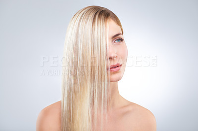 Buy stock photo Straight hair, beauty and blonde woman in makeup, care or thinking isolated on a white studio background. Face, hairstyle and serious model in cosmetics, hairdresser and salon treatment for keratin