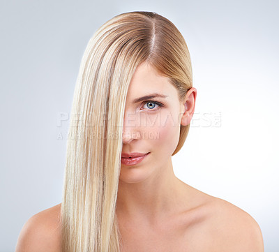 Buy stock photo A gorgeous young blonde woman posing against a white background