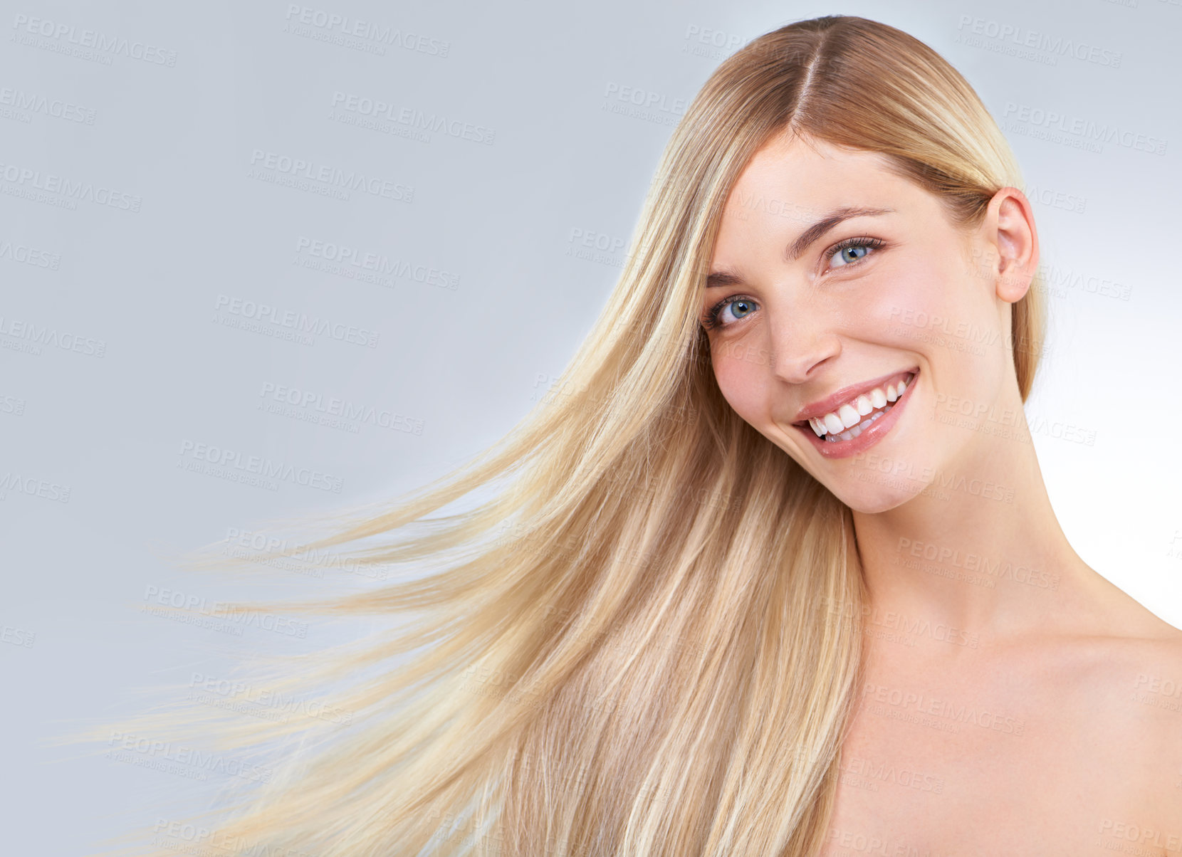 Buy stock photo Studio portrait of a young woman with long blonde hair