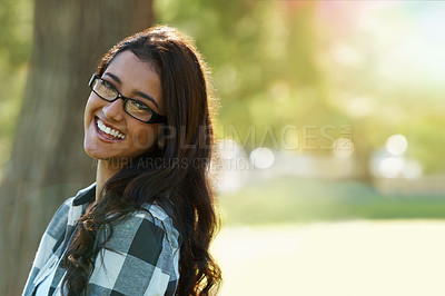 Buy stock photo Woman, portrait and happy for glasses in park or garden, smile and joyful on summer holiday. Female person, eyewear and enjoy vacation in countryside, outdoors and calm on weekend adventure in nature