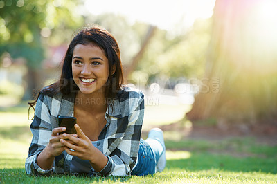 Buy stock photo Grass, phone or happy woman in park thinking of social media to chat on internet post or website notification. Nature, smile or female person on mobile app for texting, networking or typing to relax