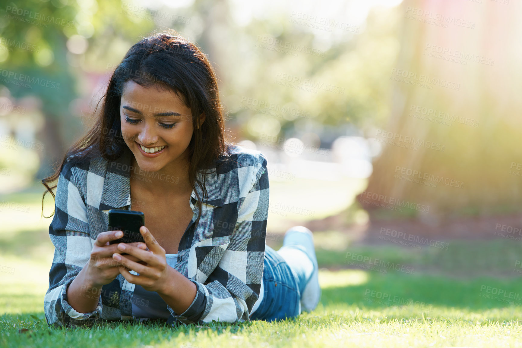 Buy stock photo Grass, phone or happy woman in park for social media to chat on internet post or website notification. Nature, smile or female person on mobile app for texting, networking or typing online to relax