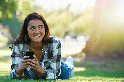 Buy stock photo Grass, phone or happy woman in nature thinking of social media to chat on internet post or website notification. Park, smile or female person on mobile app for texting, networking or typing to relax
