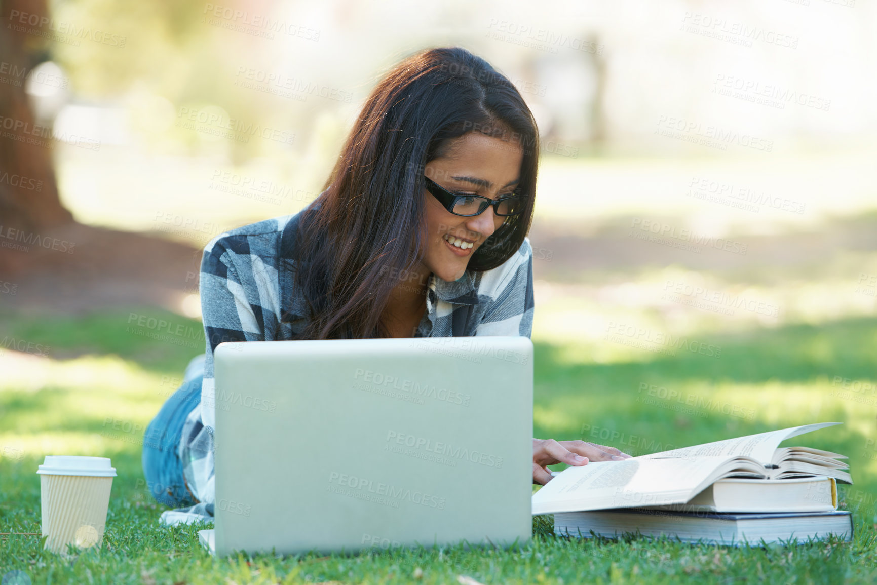 Buy stock photo Laptop, grass or happy woman in park with books for learning knowledge, information or education. Smile, textbooks or female student in nature for studying history or typing online on college campus