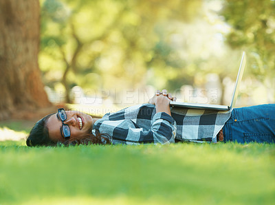 Buy stock photo Woman, park and laptop for study, learning and education for summer, college and portrait. Latino student, nature and new york trees with smile, lawn and lying down for happy, relaxing and sunshine