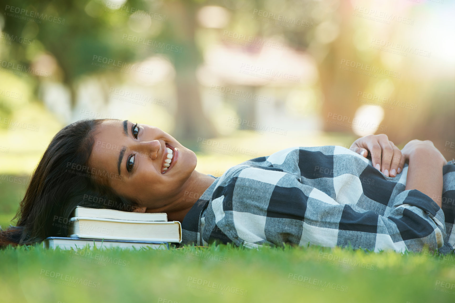 Buy stock photo Portrait, grass or happy woman in park with books for learning knowledge, information or education. Smile, textbook or student in nature for studying break or peace on college campus lawn to relax