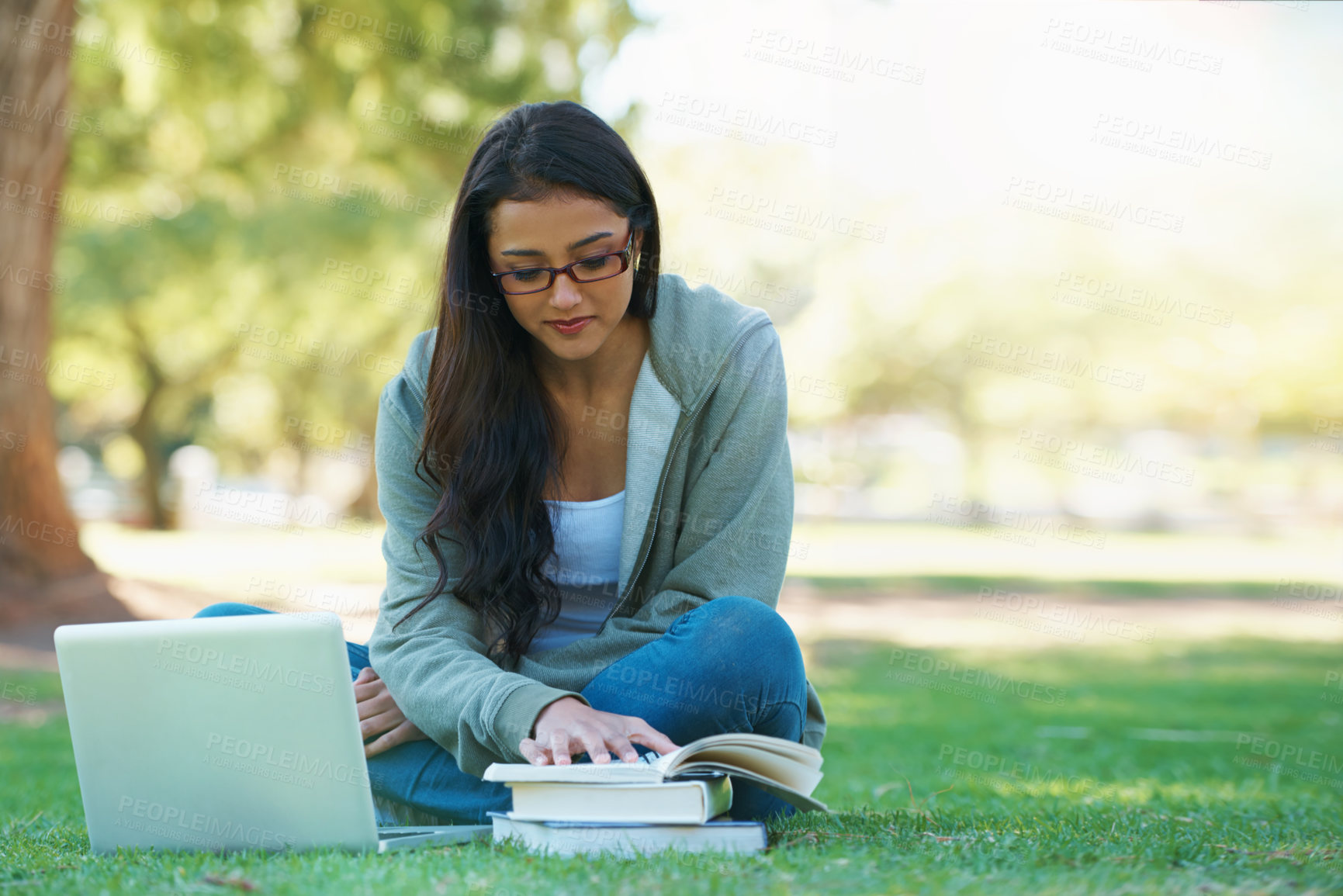 Buy stock photo Laptop, lawn or woman in nature reading books for learning knowledge, information or education. Research, textbook or female student in park on grass for studying or typing online on college campus 