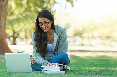 Buy stock photo Laptop, student or happy woman in nature reading book for learning knowledge, information or education. Research, textbook or person in park on grass for studying or typing online on college campus 