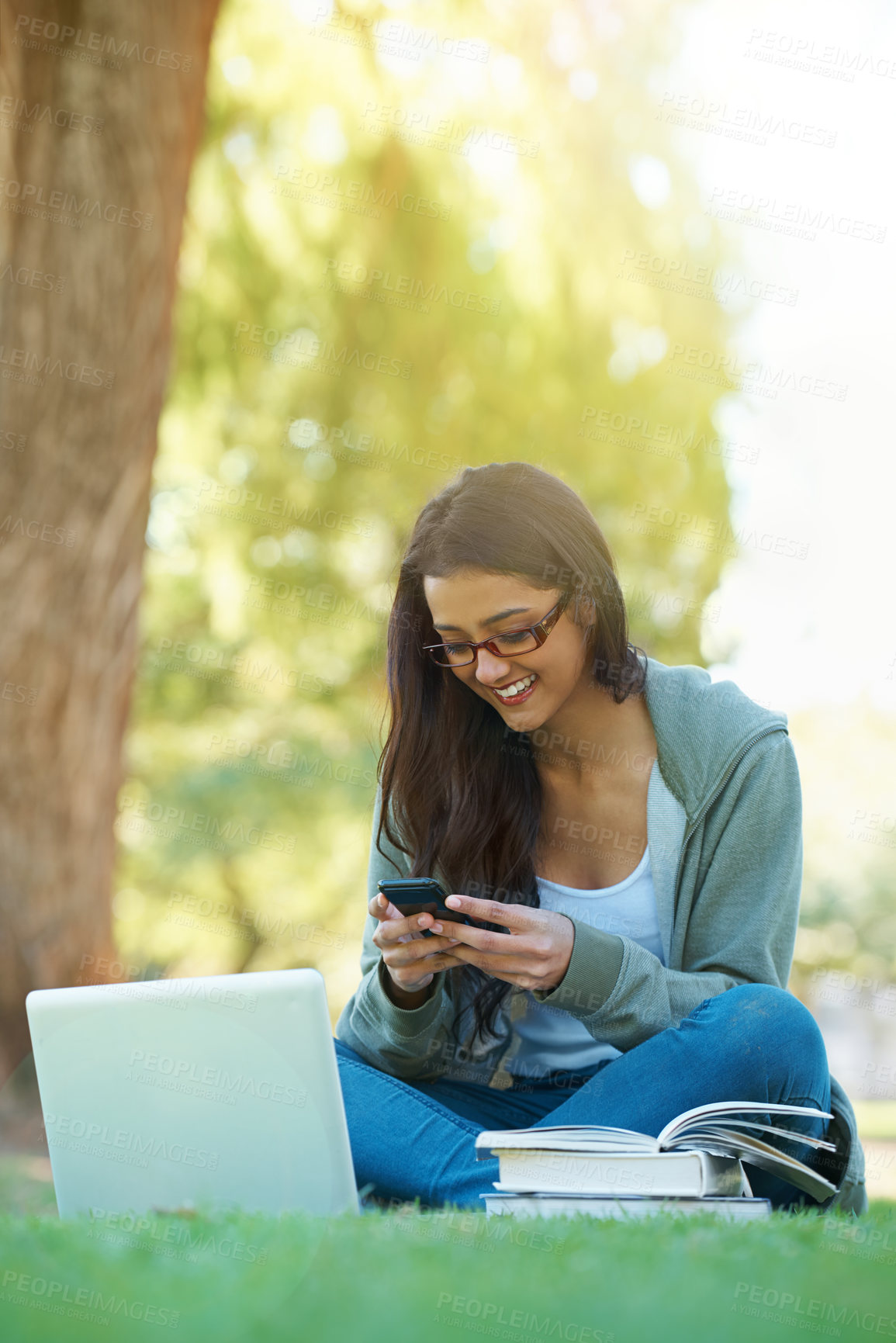 Buy stock photo Woman, garden and laptop with books, glasses and cellphone for study, learning and college. Latino student, park and technology for research, communication and university for online education