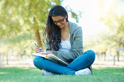 Buy stock photo Writing, grass or happy woman in nature with notes for learning knowledge, information or education. Smile, diary journal or student in park for studying idea or peace on college campus lawn to relax