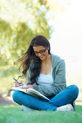 Buy stock photo Writing, lawn or happy woman in park with notes for learning knowledge, information or education. Smile, diary journal or student in nature for studying idea or books on college campus grass to relax