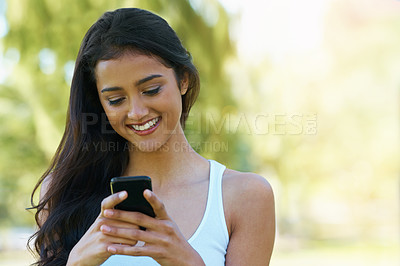 Buy stock photo Happy, woman and reading outdoor with phone to post on social media for communication. Virtual, chat and college student in woods with smartphone for networking, connection and contact in park mockup