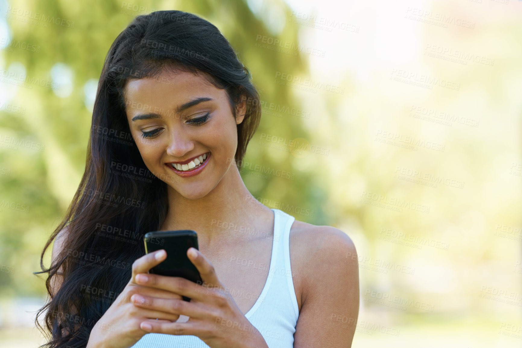 Buy stock photo Happy, woman and reading outdoor with phone to post on social media for communication. Virtual, chat and college student in woods with smartphone for networking, connection and contact in park mockup