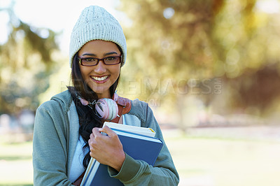 Buy stock photo Portrait, student and woman in park with books for studying,  learning and reading outdoors. Education, happy and person with bag, textbooks and headphones relax for university, campus or college