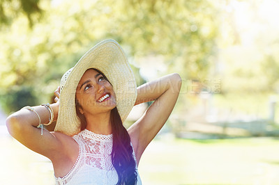 Buy stock photo Woman, travel and happy relaxing in park or garden, smiling and joyful on summer holiday. Female person, peace and enjoy vacation in countryside, outdoors and hat on weekend adventure in nature