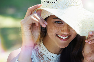 Buy stock photo Woman, portrait and happy for hat in park or garden, smiling and joyful on summer holiday. Female person, peace and enjoy vacation in countryside, outdoors and calm on weekend adventure in nature