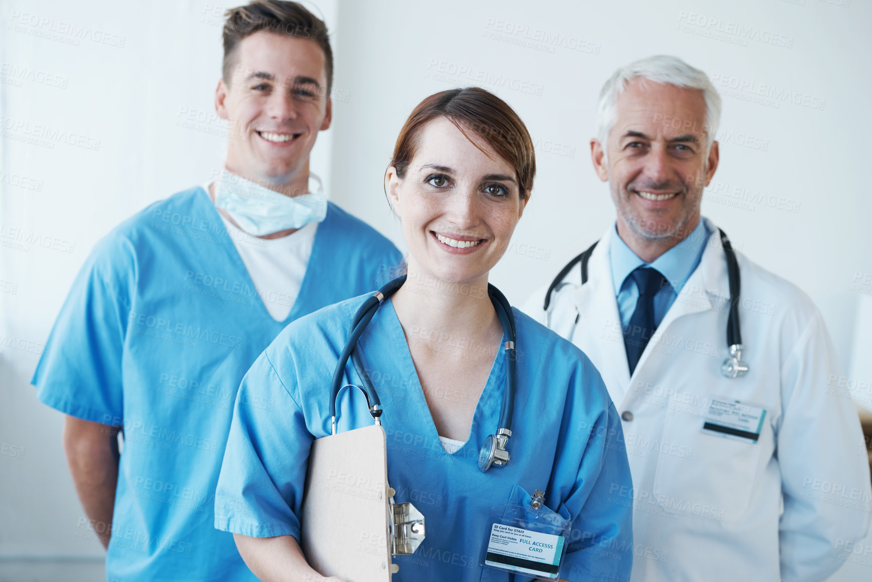 Buy stock photo Happy, portrait and doctor with nurses in hospital with clipboard for medical research in collaboration. Smile, checklist and senior male surgeon with healthcare workers in clinic for teamwork.