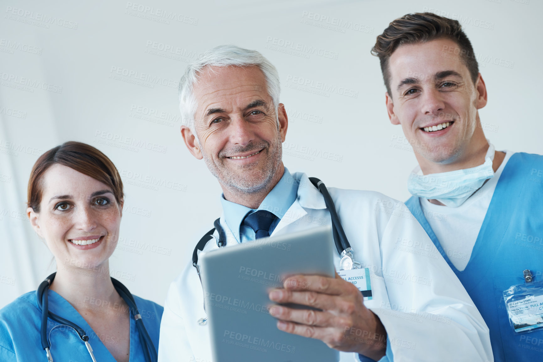 Buy stock photo Tablet, meeting and portrait of doctor with nurses in hospital for medical diagnosis or treatment discussion. Team, digital technology and surgeon talking to healthcare workers for surgery in clinic.