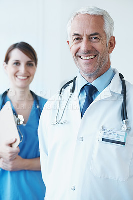 Buy stock photo Happy, portrait and senior doctor with nurse in hospital with clipboard for medical research in collaboration. Smile, checklist and mature male surgeon with healthcare worker in clinic for teamwork.