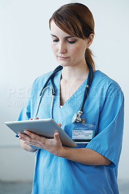 Buy stock photo Research, tablet and woman nurse in hospital for medical diagnosis or treatment information. Professional, nursing and young female healthcare worker with digital technology in medicare clinic.