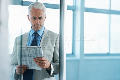 Buy stock photo Man, business and reading newspaper with concern as financial consultant for stock market, review or report. Male person, frown and corporate professional for investment problem, trouble or stress