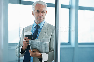 Buy stock photo Portrait of a mature businessman drinking a  coffee and a newspaper