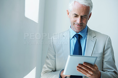 Buy stock photo Mature, businessman and tablet for online research as law attorney as corporate professional, email or networking. Male person, employee and internet in office for web planning, startup or Canada