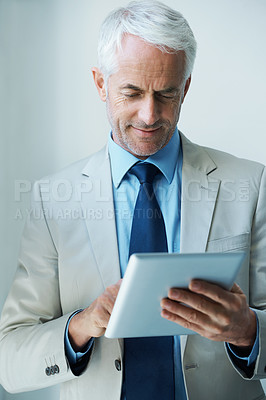 Buy stock photo Mature, businessman and tablet for online networking as law attorney as corporate professional, email or reading. Male person, employee and internet in office for connect planning, startup or Canada