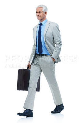 Buy stock photo Full length studio shot of a mature businessman walking with a briefcase isolated on white