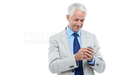 Buy stock photo Studio shot of a mature businessman using a cellphone isolated on white